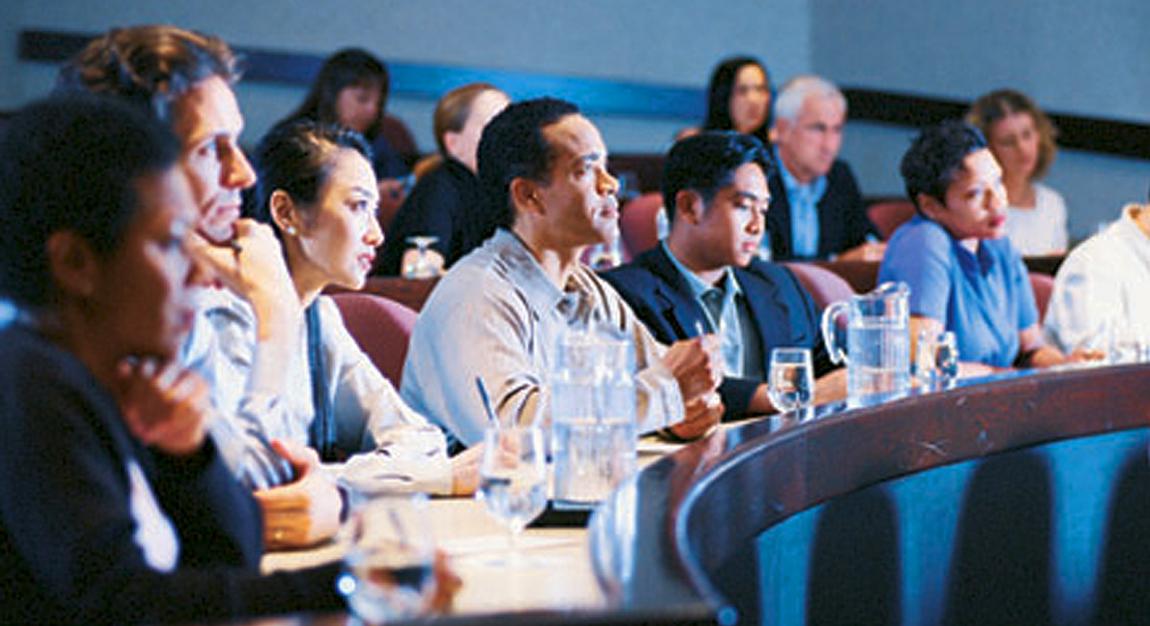 Group of men and women physicians in classroom setting