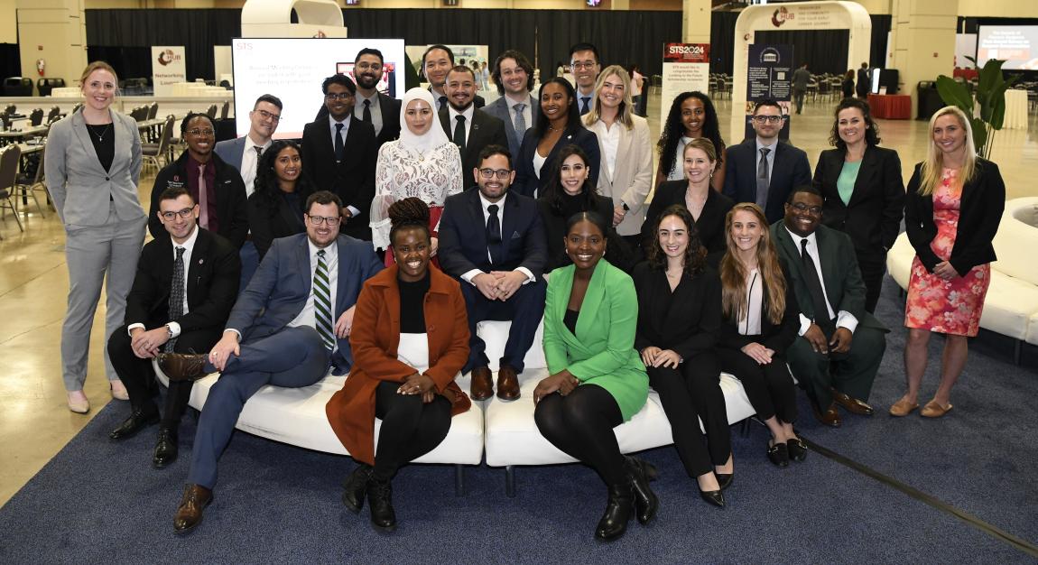 Diverse group of trainees and young professionals seated in The Hub