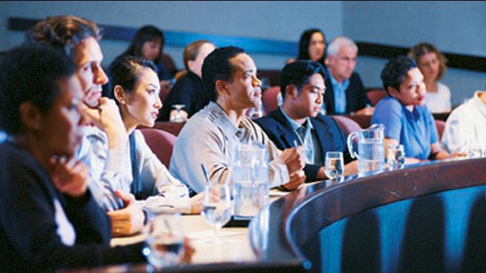 Group of men and women physicians in classroom setting