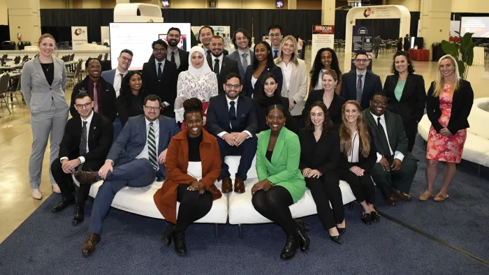 Diverse group of trainees and young professionals seated in The Hub